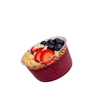 Acai smoothie bowl topped with granola, strawberries, blueberries and banana
